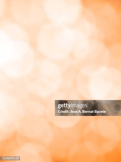 close-up unfocused lights in the shape of circles of light soft orange background. - white gradient stock pictures, royalty-free photos & images