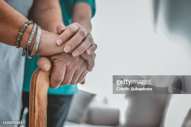 caring for the needy - grandma cane stock pictures, royalty-free photos & images