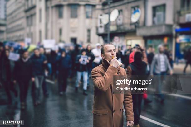 young protester - street riot stock pictures, royalty-free photos & images