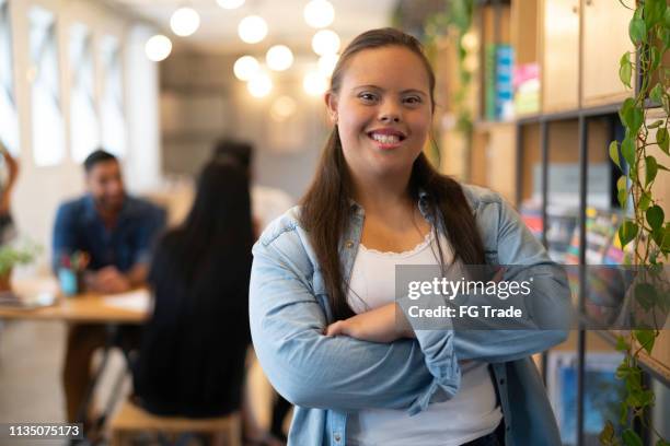 special needs businesswoman portrait at modern startup company - women equality stock pictures, royalty-free photos & images