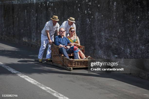 tourists in a sleigh - madeira material stock pictures, royalty-free photos & images