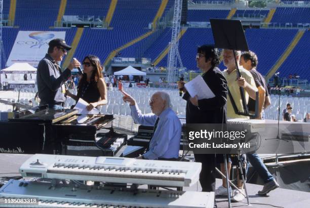 Italian actors Christian De Sica and sabrina Ferilli, music composer Armando rovajoli and singer Renato Zero during rehearsals for a benefit concert...