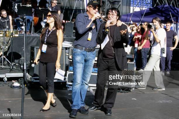 Italian actors Sabrina Ferilli and Christian De Sica, and singer Renato Zero during rehearsals for a benefit concert for earthquake victims in...