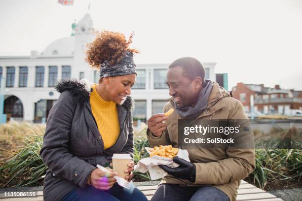 dinner date - fast food french fries stock pictures, royalty-free photos & images