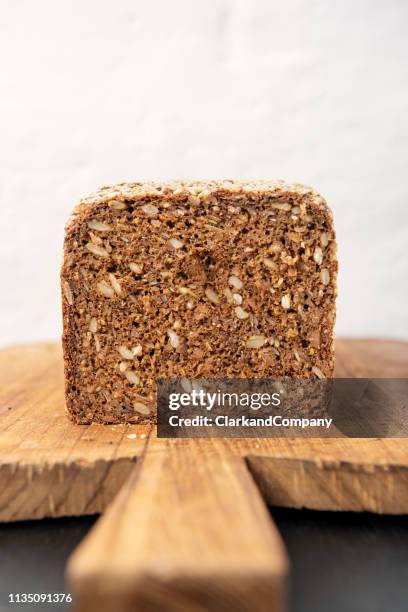 loaf of organic rye bread. - rye bread stock pictures, royalty-free photos & images