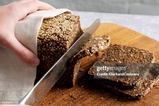 loaf of organic rye bread. - whole wheat stock pictures, royalty-free photos & images