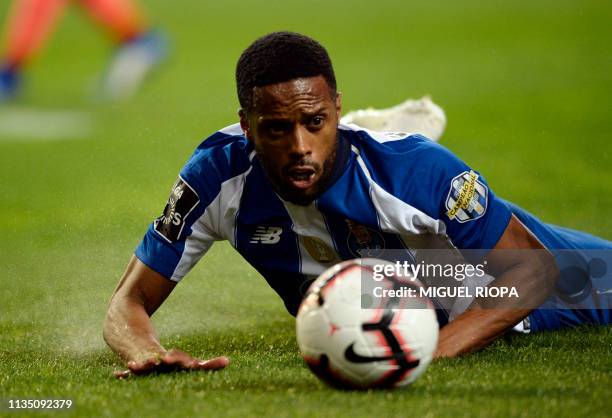 Porto's Portuguese forward Hernani Fortes lies on the ground during the Portuguese league football match between FC Porto and Boavista FC at the...