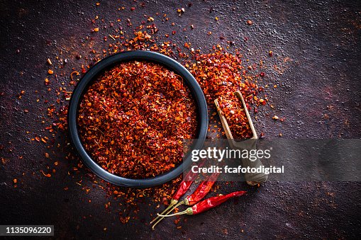 Red chili pepper flakes shot from above Red chili pepper flakes shot from above