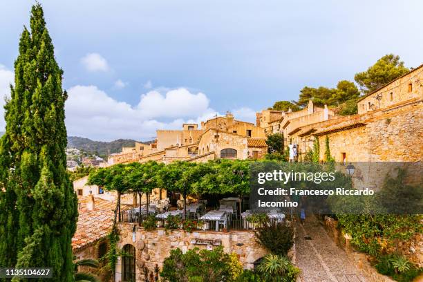 tossa de mar, spain. roofs and sea - tossa de mar bildbanksfoton och bilder