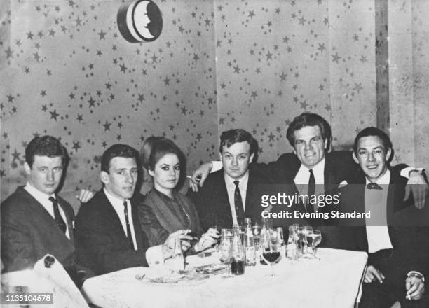 British criminal Reginald 'Reggie' Kray , his wife Frances Shea , British boxer Freddie Mills and others at a gala dinner, UK, circa 1965.