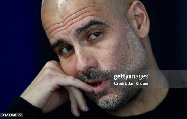 Josep Guardiola, Manager of Manchester City looks on during a press conference ahead of their UEFA Champions League Round of 16 second leg match...