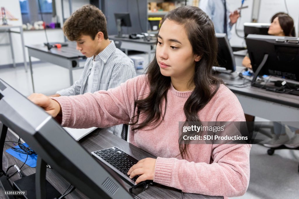 Girls Computer Lab Confident Teenage Girl Works On Computer Lab Project High-Res Stock ...