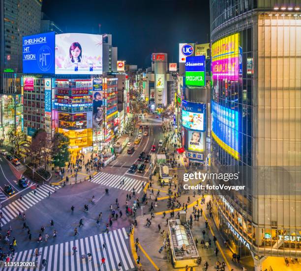 tokyo shibuya crossing neon billboards crowded city streets night japan - shibuya station stock pictures, royalty-free photos & images