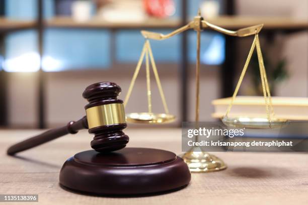 justice scales and books and wooden gavel - justiça imagens e fotografias de stock