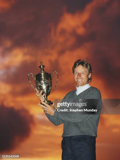 Bernhard Langer of Germany celebrates with the trophy after winning the Benson & Hedges International Open on 11 May 1997 at The Oxfordshire Golf...