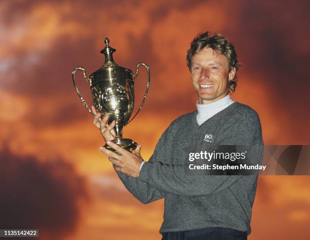 Bernhard Langer of Germany celebrates with the trophy after winning the Benson & Hedges International Open on 11 May 1997 at The Oxfordshire Golf...