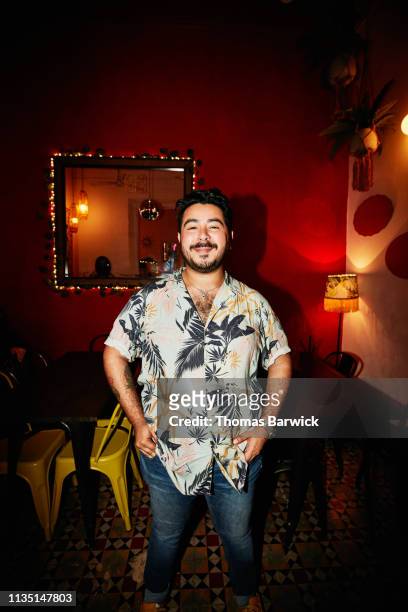 Portrait of smiling man standing in night club