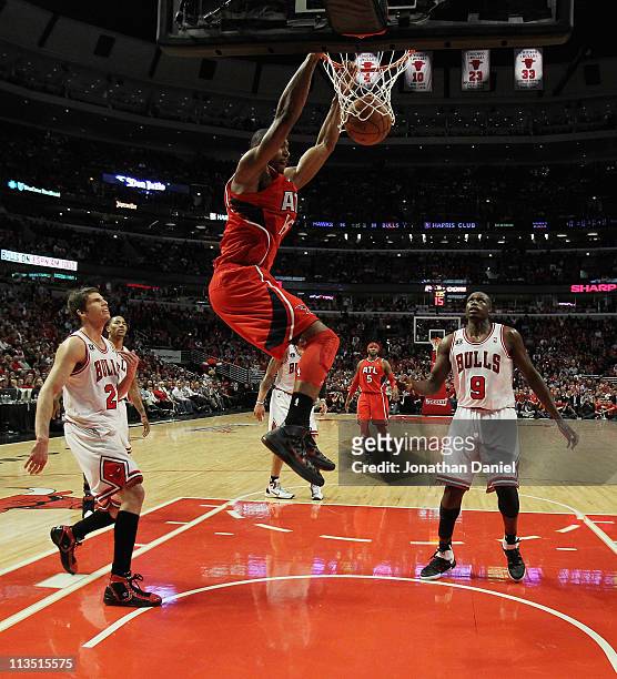 Al Horford of the Atlanta Hawks dunks the ball over Kyle Korver and Loul Deng of the Chicago Bulls in Game One of the Eastern Conference Semifinals...