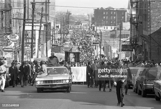 Procession moves along Newark's Springfield Avenue during a memorial march for Dr. Martin Luther King, Jr. An estimated 25,000 persons marched in the...