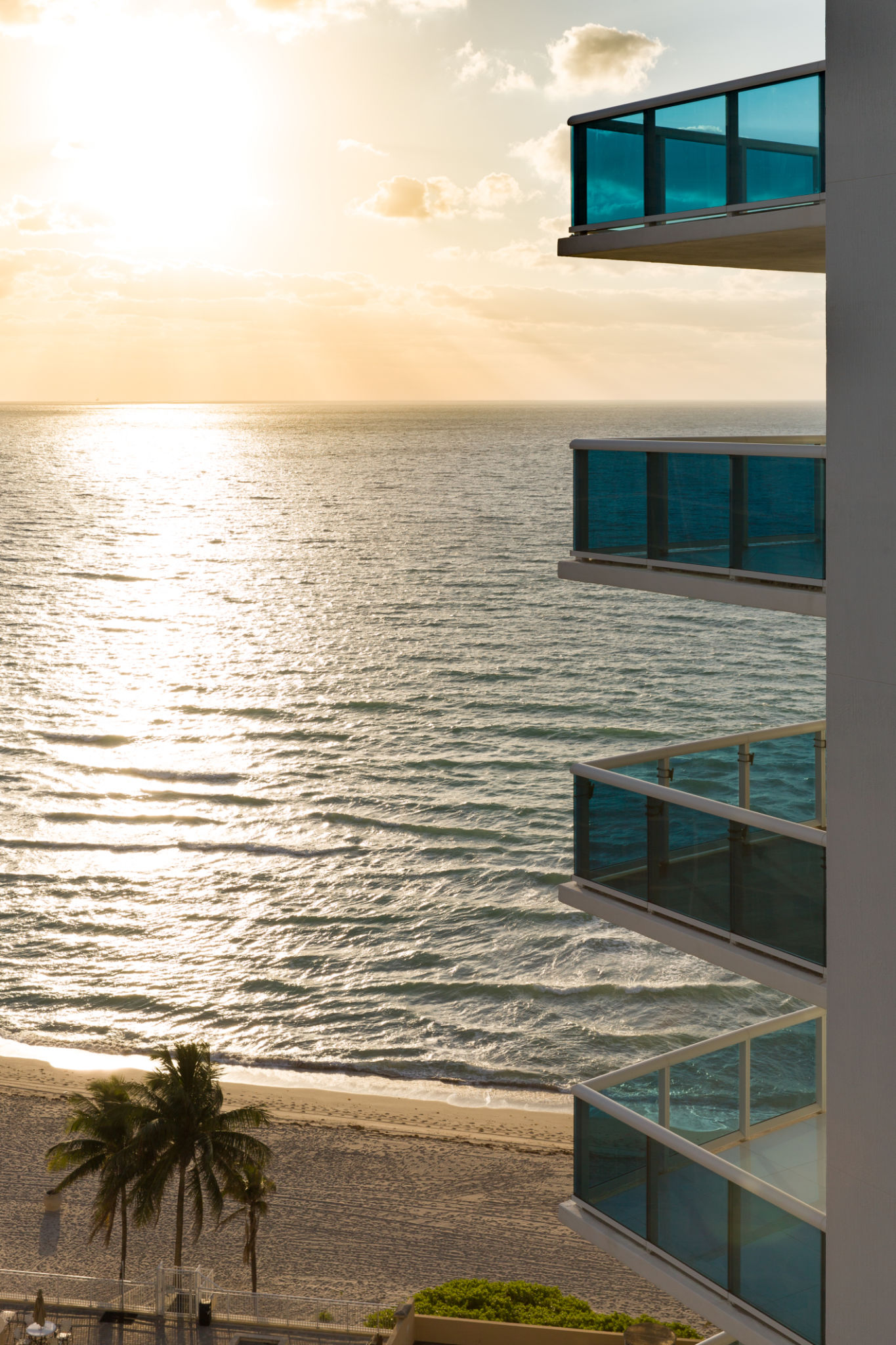 Beautiful view from balcony on calm ocean in the early morning. Sunset at the beach. Tourism, vacations. Beautiful view from balcony on calm ocean in the early morning. Sunset at the beach. Tourism, vacations.