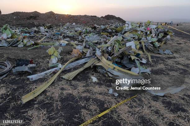 Debris pile sits just outside the impact crater where Ethiopian Airlines Flight ET302 crashed as recovery efforts continue on March 11, 2019 in...