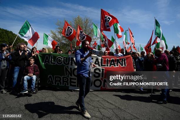 Activists from Italian neo-fascist group CasaPound demonstrate on April 6, 2019 in the Torre Maura district of Rome, two days after Rome residents...