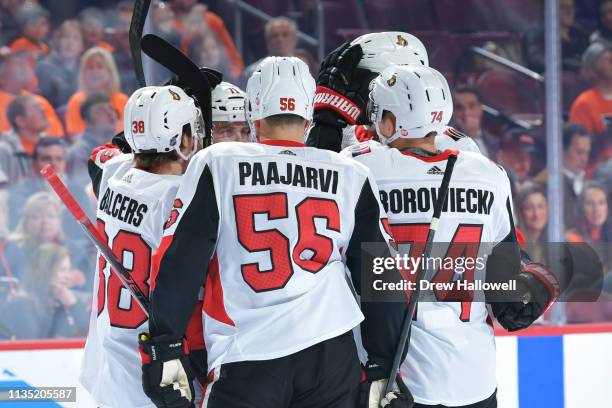 Rudolfs Balcers, Magnus Paajarvi and Mark Borowiecki congratulate teammate Chris Tierney of the Ottawa Senators on a goal against the Philadelphia...