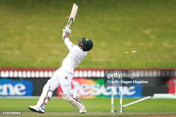 Mustafizur Rahman of Bangladesh is bowled out by Trent Boult of New Zealand during day five of the second test match in the series between New...