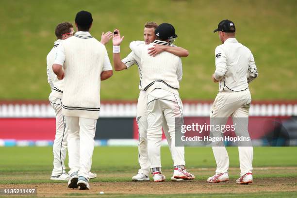 Neil Wagner of New Zealand celebrates with teammates after taking the wicket of Ebadat Hossain of Bangladesh to win the second test match in the...