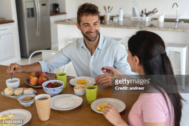 brazilian couple eating breakfast at home - tapioca stock pictures, royalty-free photos & images