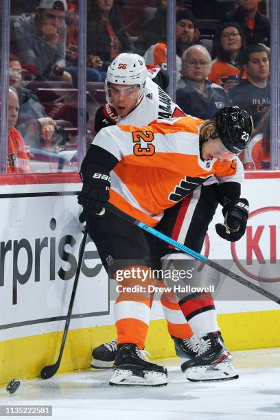 Magnus Paajarvi of the Ottawa Senators and Oskar Lindblom of the Philadelphia Flyers fight for the puck in the third period at Wells Fargo Center on...