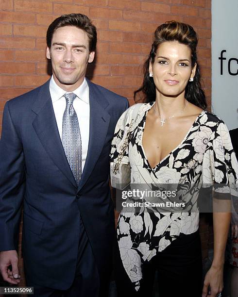Jason Sehorn and Angie Harmon during "Vote FCUK 2004" - A French Connection/"Rock the Vote" Event at Soho French Connection Store in New York City,...