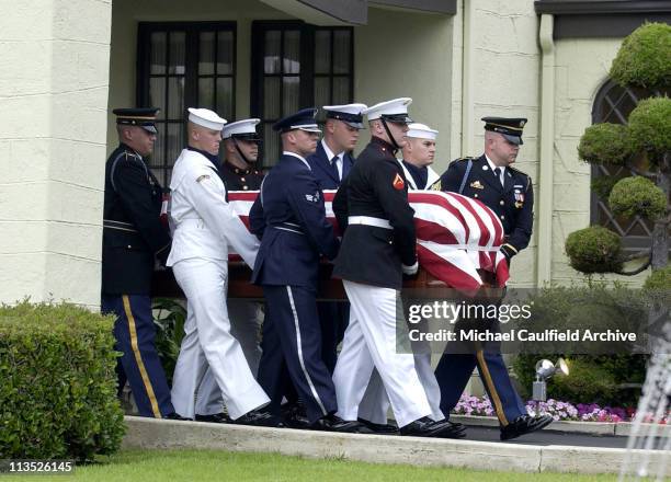 Military pallbearers carry the coffin of former President Ronald Reagan to the hearse at Gates Kingsley and Gates Moeller Murphy funeral home in...