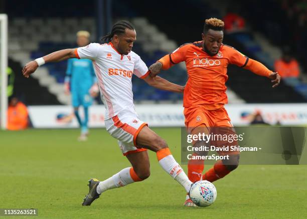 Blackpool's Nathan Delfouneso battles with Luton Town's James Justin during the Sky Bet League One match between Luton Town and Blackpool at...