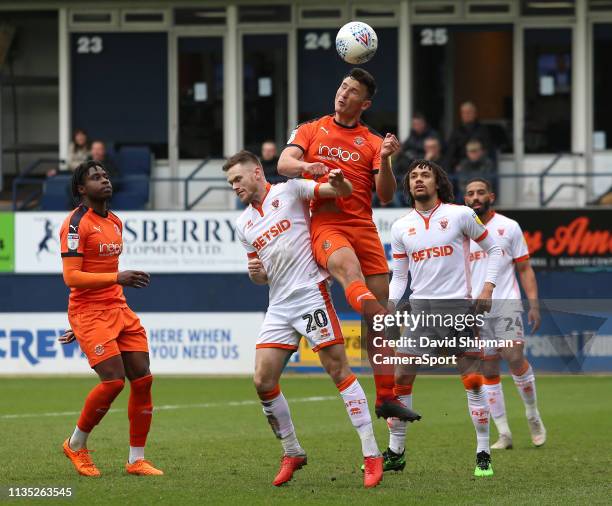 Blackpool's Oliver Turton battles with Luton Town's Matty Pearson during the Sky Bet League One match between Luton Town and Blackpool at Kenilworth...