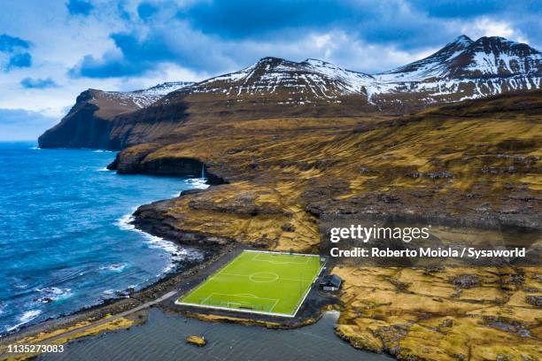 soccer field, eidi, eysturoy island, faroe islands - winter denmark stock pictures, royalty-free photos & images