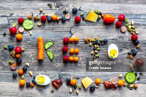 keto shaped from fruits and vegetables, framed by divers food - paleo diet stock pictures, royalty-free photos & images