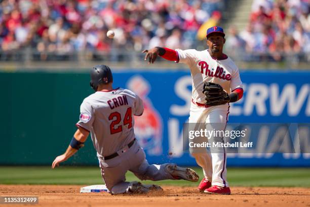 Jean Segura of the Philadelphia Phillies turns a double play against C.J. Cron of the Minnesota Twins in the top of the second inning at Citizens...