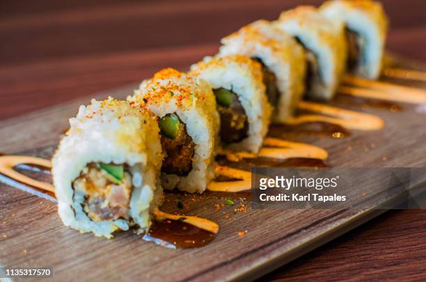 a high-angle and close-up view of freshly made tuna sushi - daily life in manila imagens e fotografias de stock