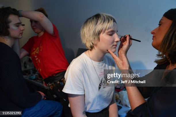 Students prepare backstage before their third year Fashion Design and Textile Design catwalk show at the Vic in the Glasgow School of Art on March...