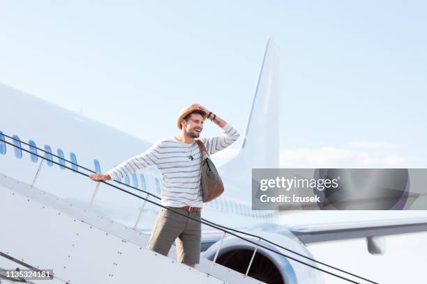 man disembarking a flight - getting on stock pictures, royalty-free photos & images