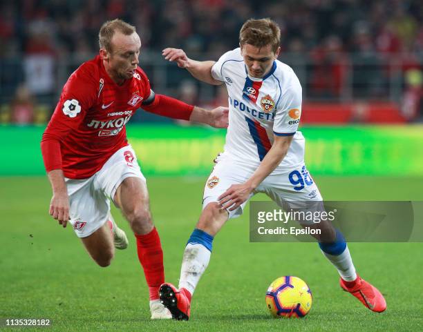 Denis Glushakov of FC Spartak Moscow vies for the ball with Ivan Oblyakov of PFC CSKA Moscow during the Russian Premier League match between FC...