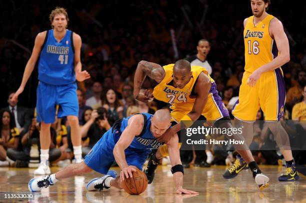 Jason Kidd of the Dallas Mavericks and Kobe Bryant of the Los Angeles Lakers battle for a loose ball in the third quarter in Game One of the Western...