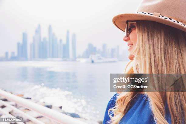 girl enjoying her day out near palm jumeirah - dubai tourist stock pictures, royalty-free photos & images