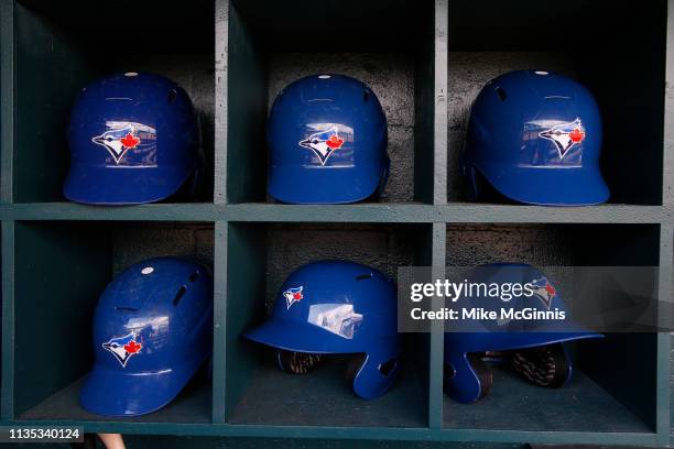 The Toronto Blue Jays dugout and batting helmets during the Spring Training game against the Pittsburgh Pirates at LECOM Park on February 27, 2019 in...