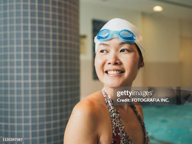 young asian woman at the swimming pool - woman swimsuit happy normal stock pictures, royalty-free photos & images