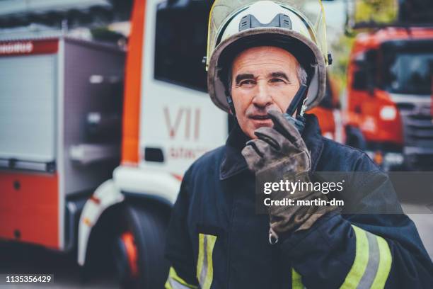 firefighter concept - firemen at work stock pictures, royalty-free photos & images