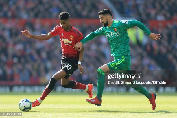 Marcus Rashford of Man Utd battles with Miguel Angel Britos of Watford during the Premier League match between Manchester United and Watford at Old...