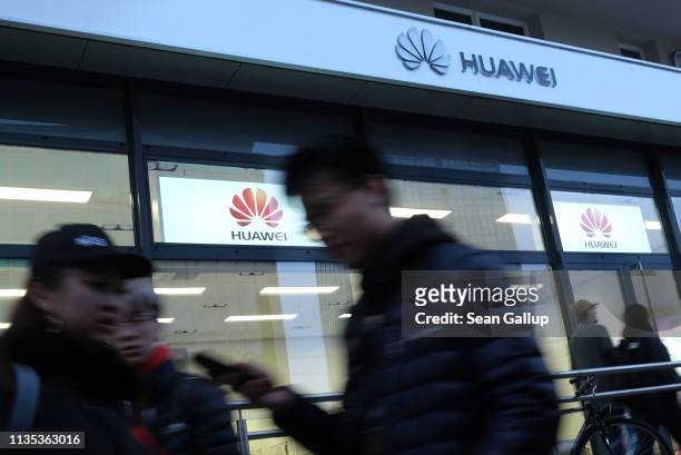 People walk past a Huawei customer service center on March 12, 2019 in Berlin, Germany. The U.S. Government has warned Germany not to consider Huawei...