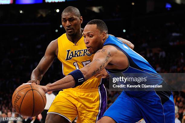 Shawn Marion of the Dallas Mavericks and Ron Artest of the Los Angeles Lakers go after a loose ball in the second half in Game One of the Western...